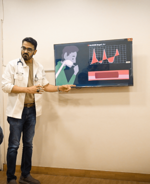 Dr. Ikram providing thyroid weight gain treatment in Karachi.