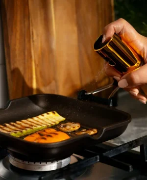 Using an oil spray bottle with the best cooking oil for heart patients to strictly manage dietary fat portions while cooking.