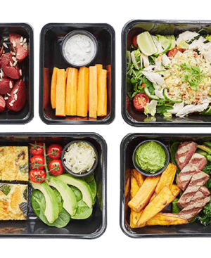 A top-down view of healthy meal prep containers showcasing small portions for The Light Diet.