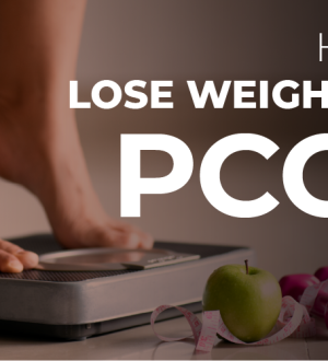 A person's feet on a weight scale next to an apple, measuring tape, and dumbbells, illustrating PCOS weight loss strategies.